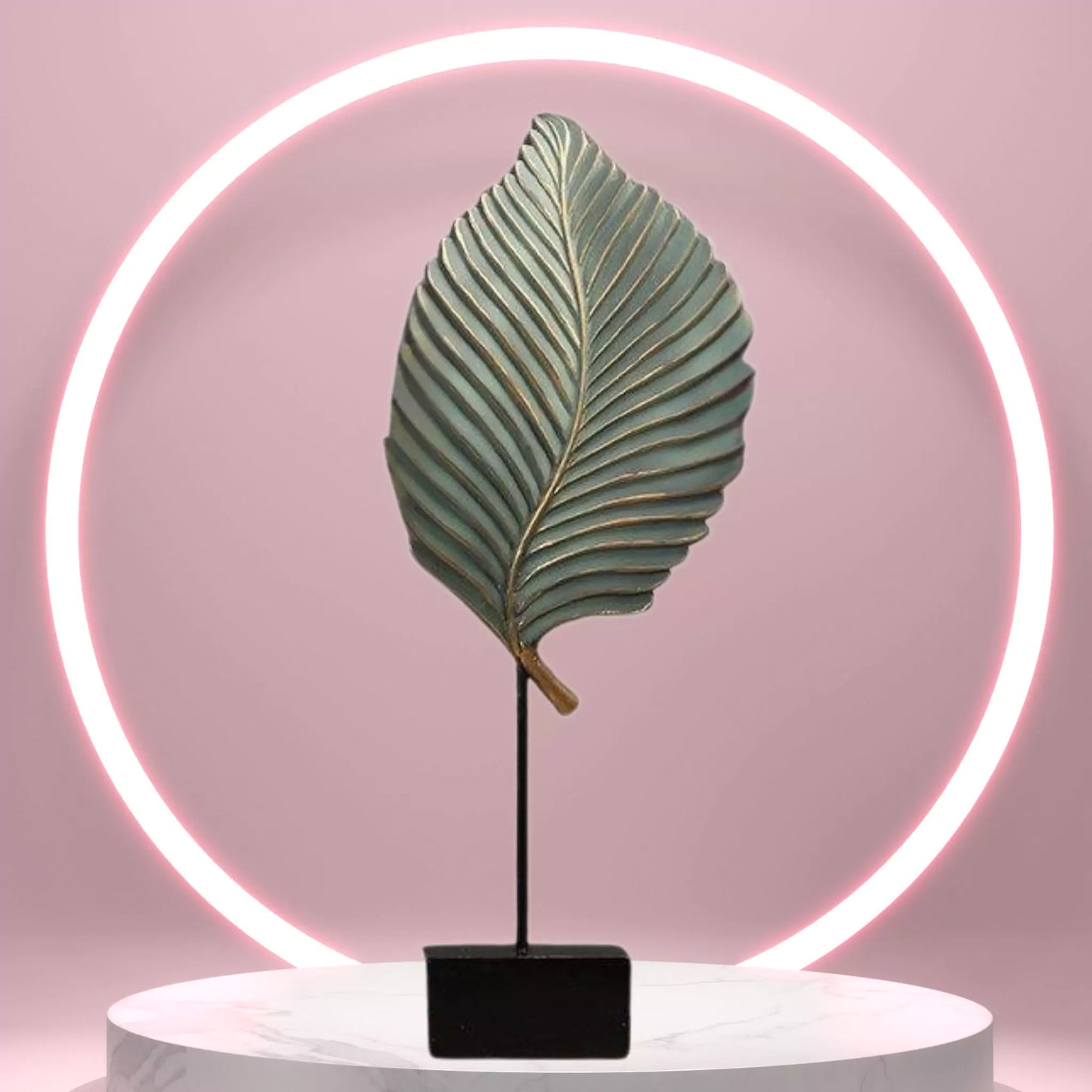 Decorative leaf lamp with neon light on a pink background