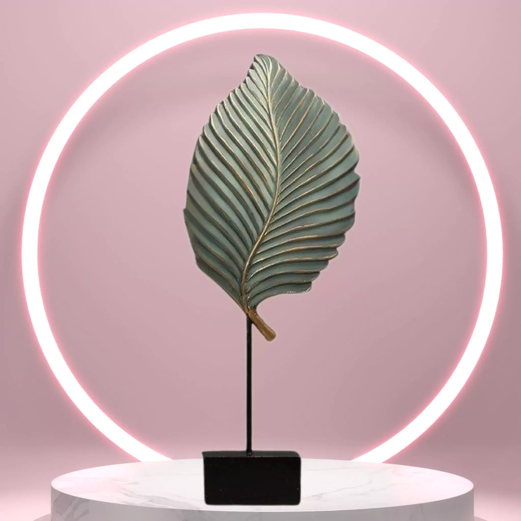 Decorative leaf lamp with neon light on a pink background