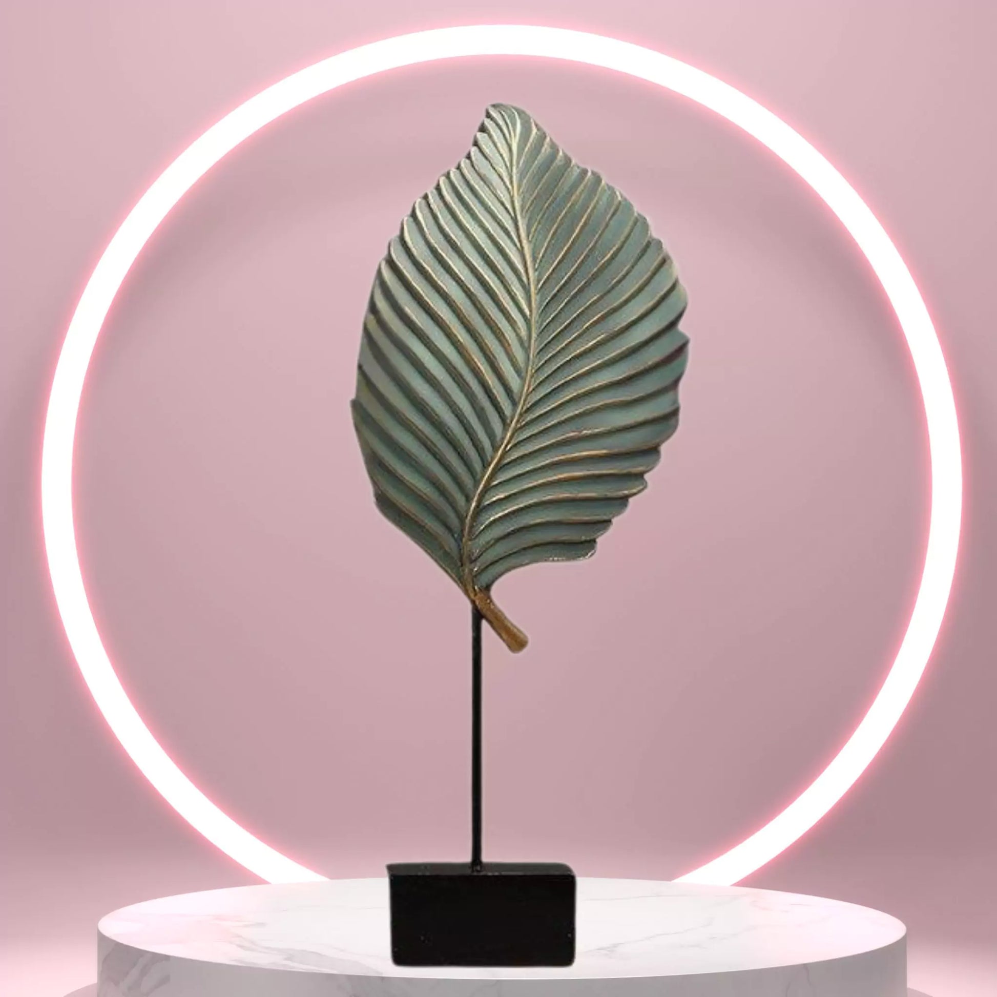 Decorative leaf lamp with neon light on a pink background